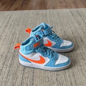 Nike Big Kids Court Borough Mid 2 in the Aquarius Blue/Total Orange/White